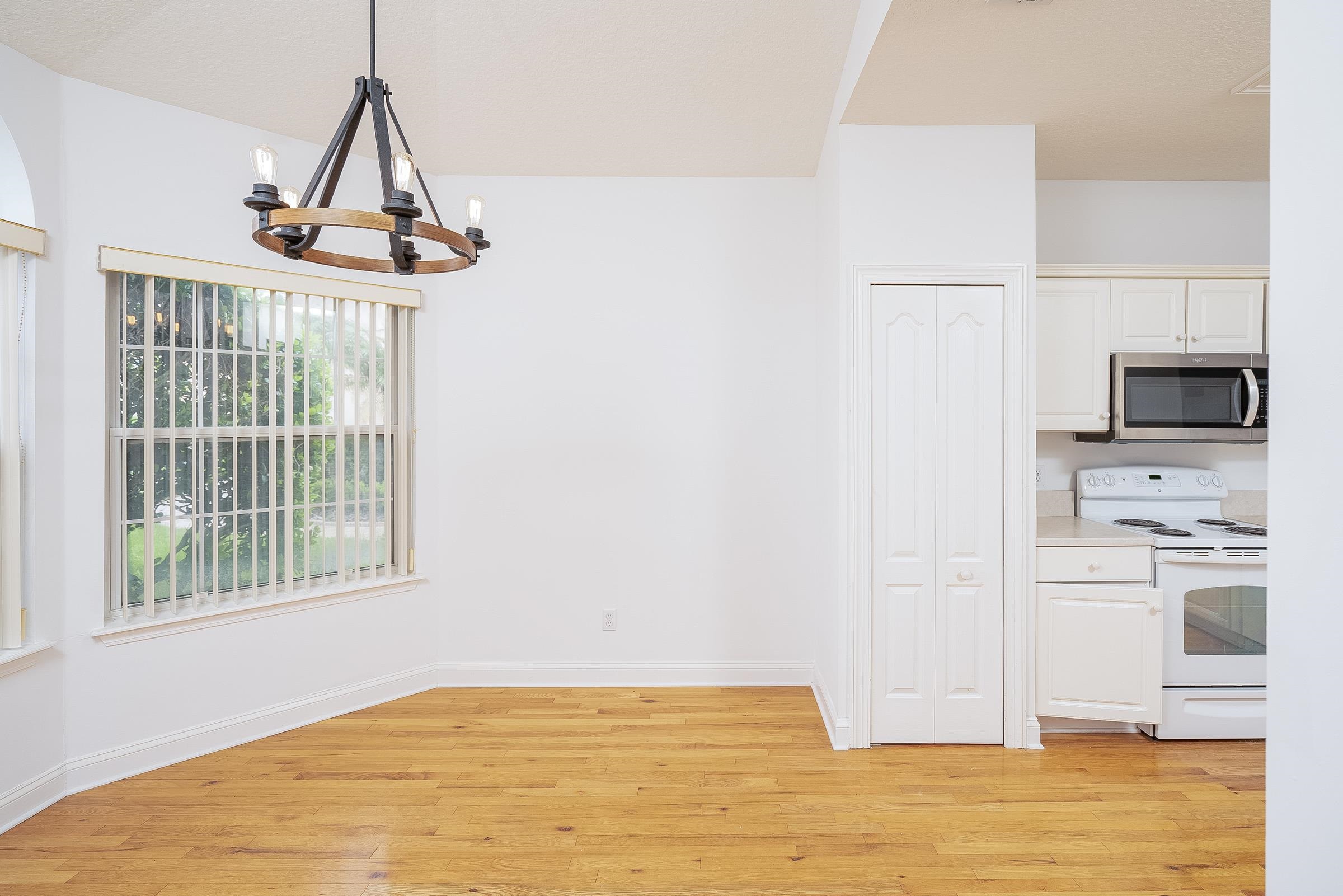 121 Tide Watch Drive St. Augustine, FL 32080 - Photo 22 of 49 a view of a kitchen with wooden floor and windows