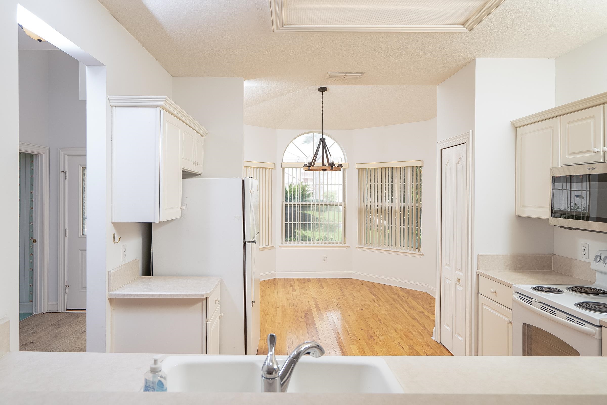 121 Tide Watch Drive St. Augustine, FL 32080 - Photo 30 of 49 a bathroom with a tub sink and mirror