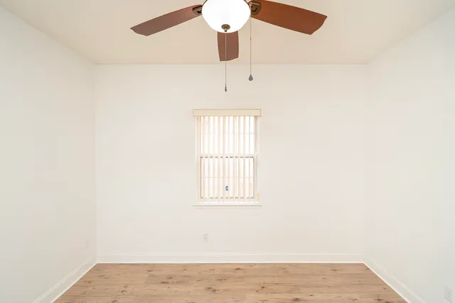 a view of a hallway with a window