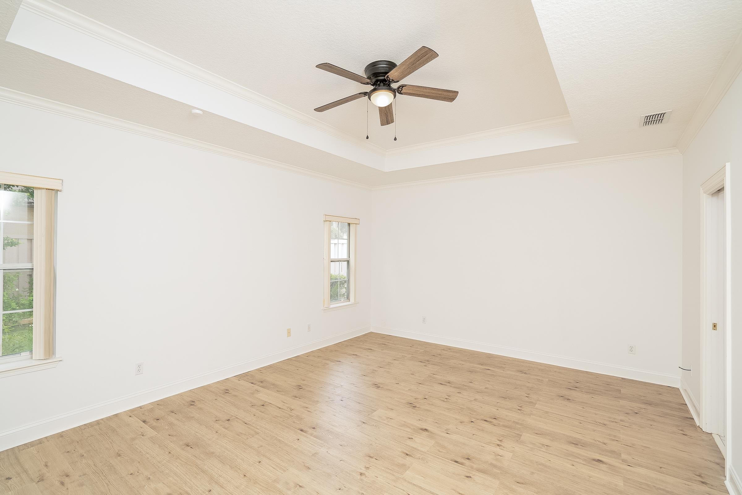 121 Tide Watch Drive St. Augustine, FL 32080 - Photo 37 of 49 an empty room with a ceiling fan and window