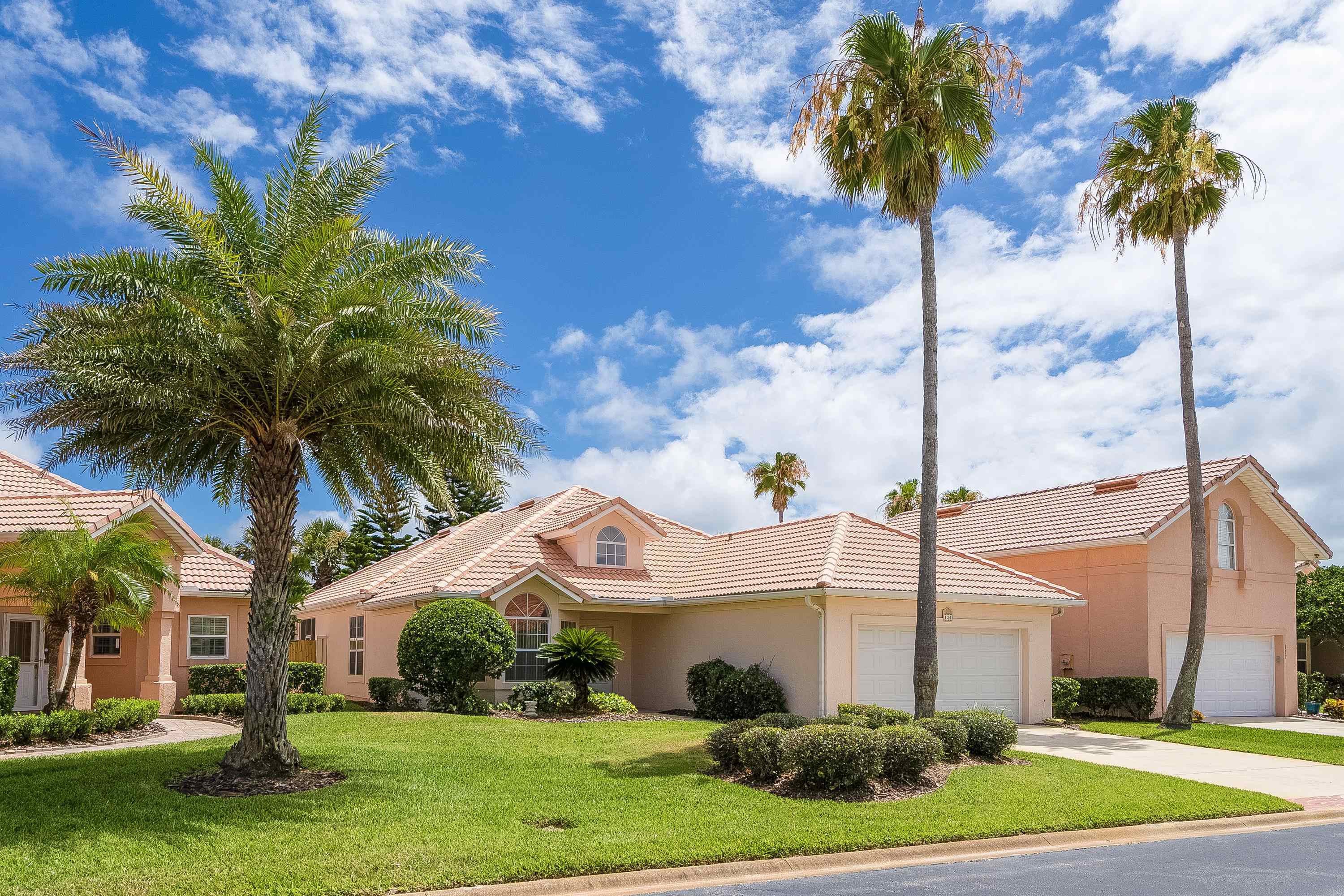 121 Tide Watch Drive St. Augustine, FL 32080 - Photo 4 of 49 a view of a house with a yard and palm trees