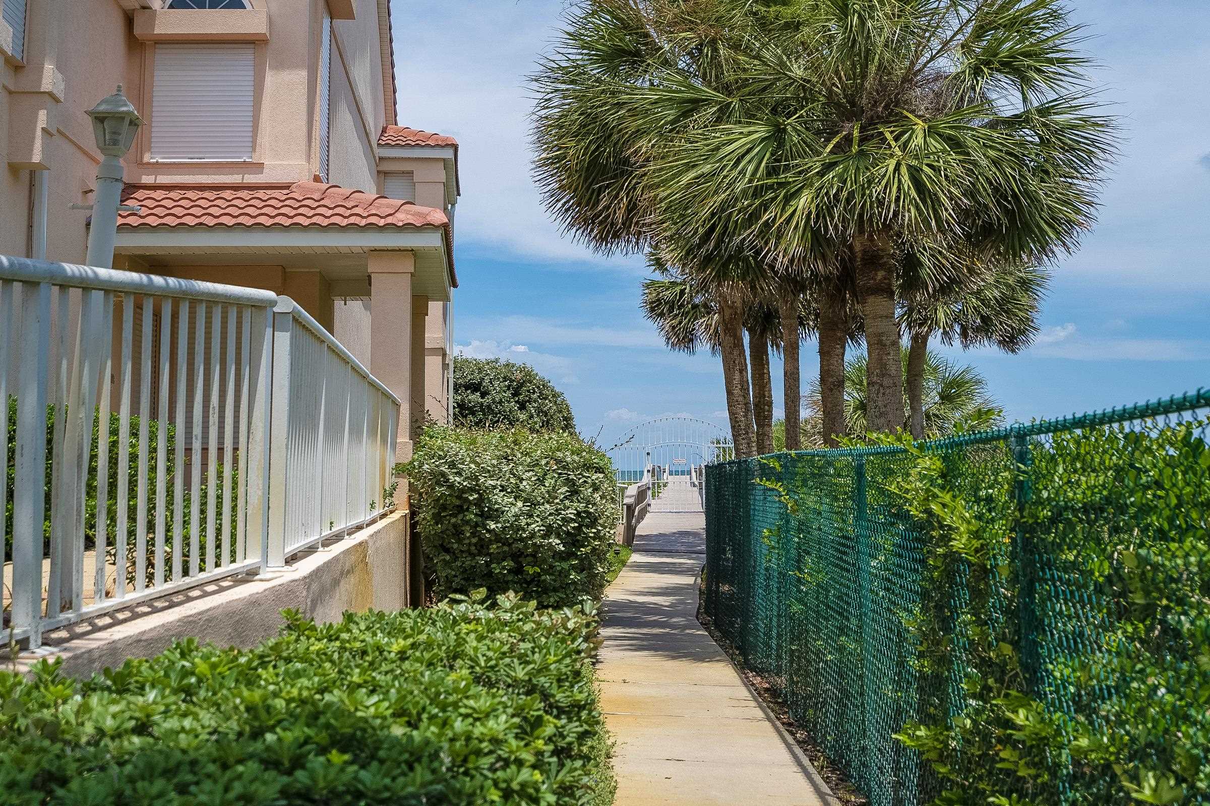 121 Tide Watch Drive St. Augustine, FL 32080 - Photo 47 of 49 a potted plant sitting in front of a house