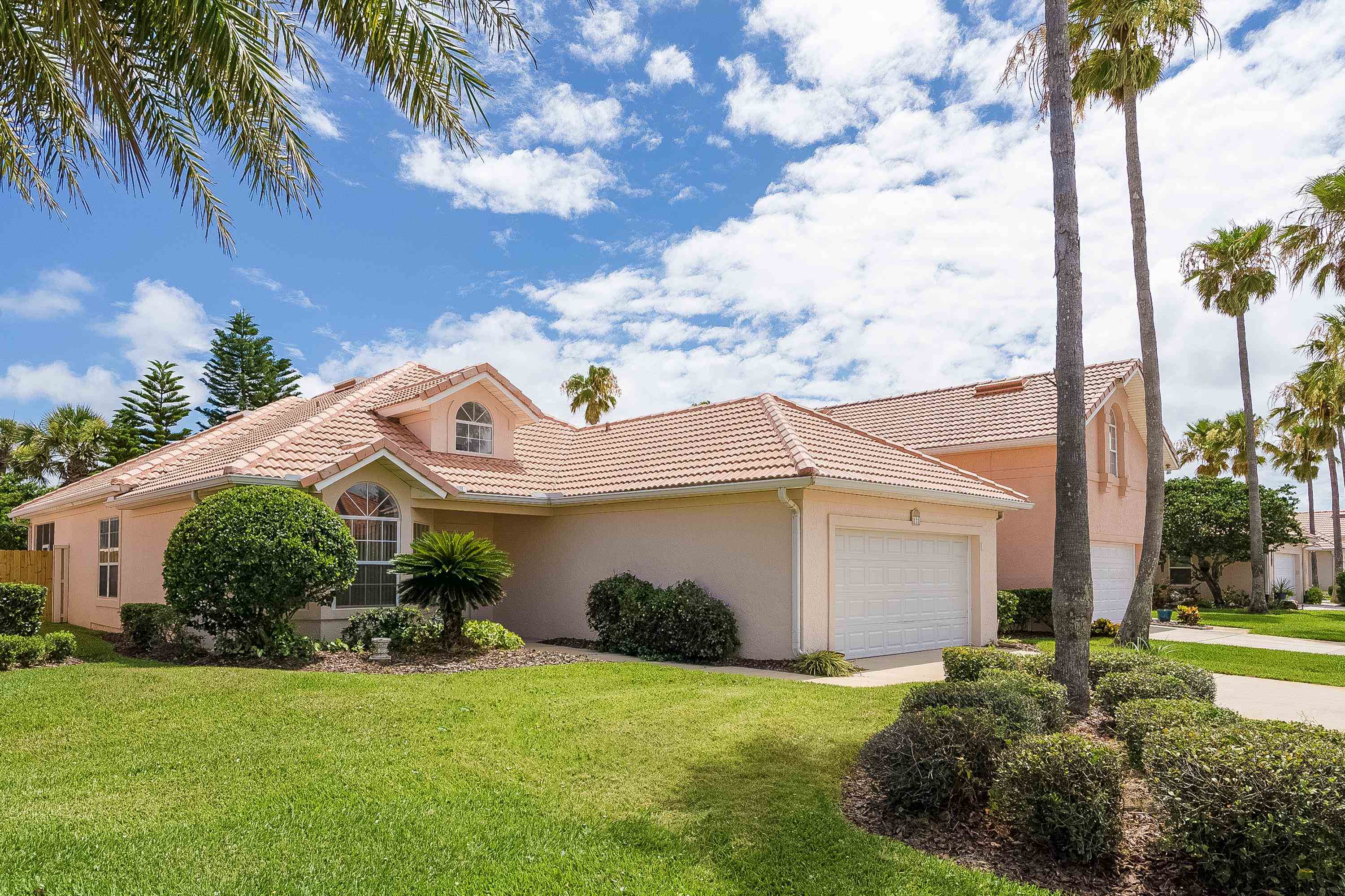 121 Tide Watch Drive St. Augustine, FL 32080 - Photo 6 of 49 a front view of a house with garden