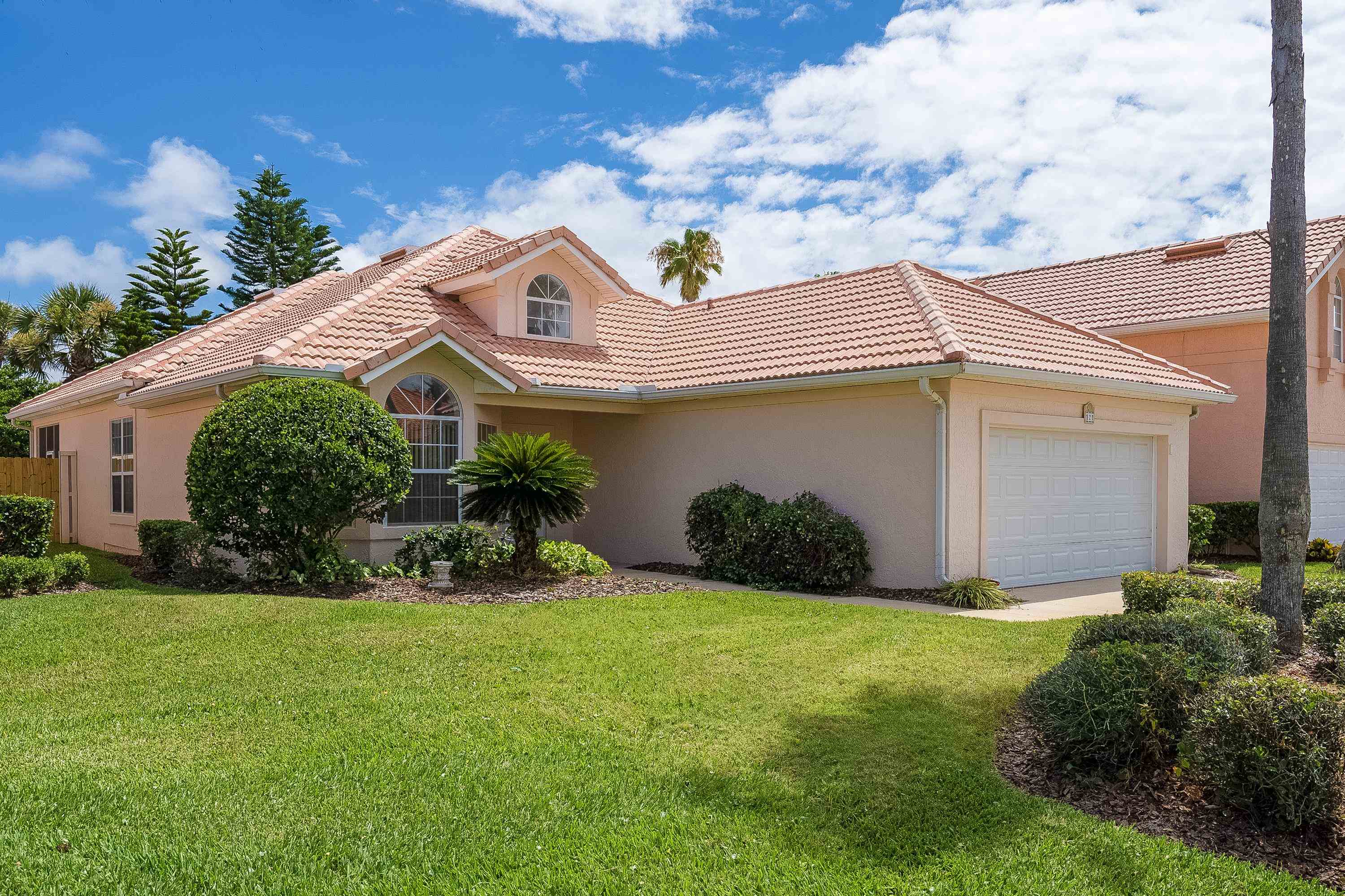 121 Tide Watch Drive St. Augustine, FL 32080 - Photo 7 of 49 a front view of a house with garden and porch