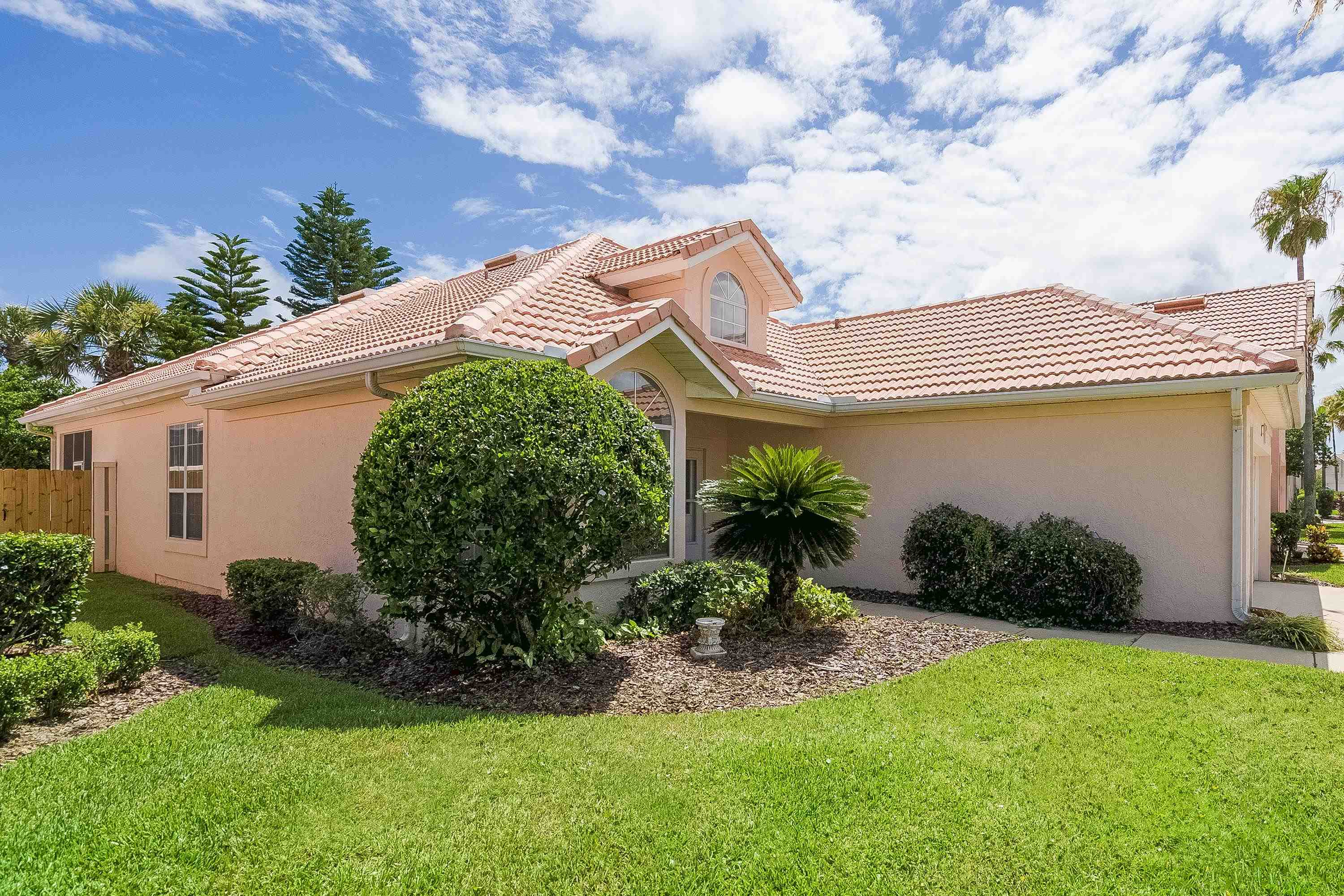 121 Tide Watch Drive St. Augustine, FL 32080 - Photo 8 of 49 a front view of a house with garden