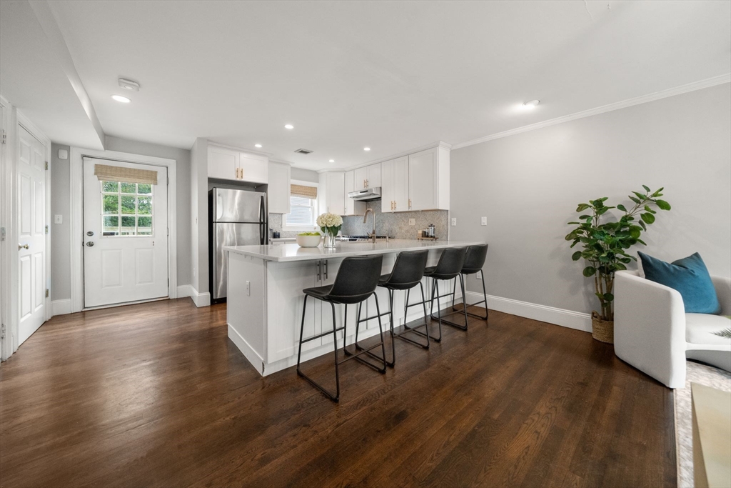 3 Glover Court, Unit 2 Boston, MA 02127 - Photo 1 of 27 a living room with furniture and a potted plant