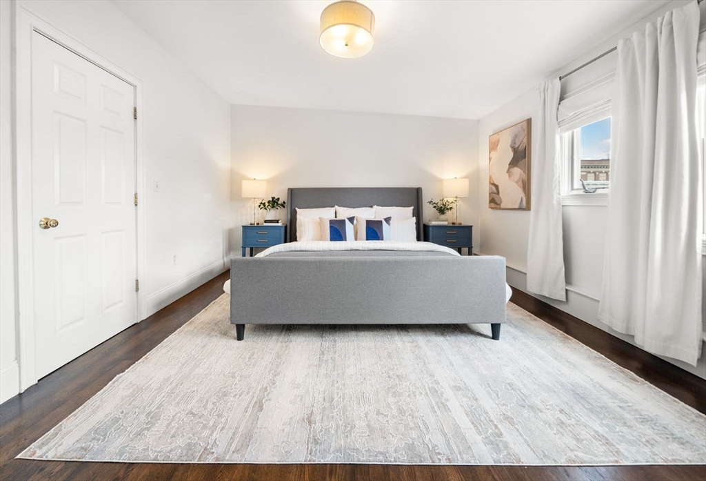 3 Glover Court, Unit 2 Boston, MA 02127 - Photo 13 of 27 a bedroom with a bed and a window