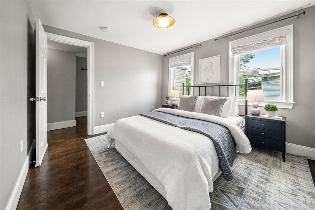 3 Glover Court, Unit 2 Boston, MA 02127 - Photo 20 of 27 a bedroom with a bed and a window