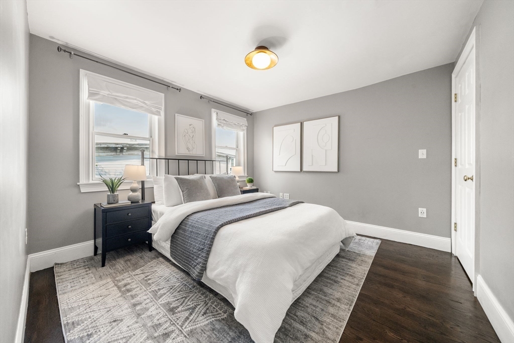 3 Glover Court, Unit 2 Boston, MA 02127 - Photo 21 of 27 a bedroom with a bed and window