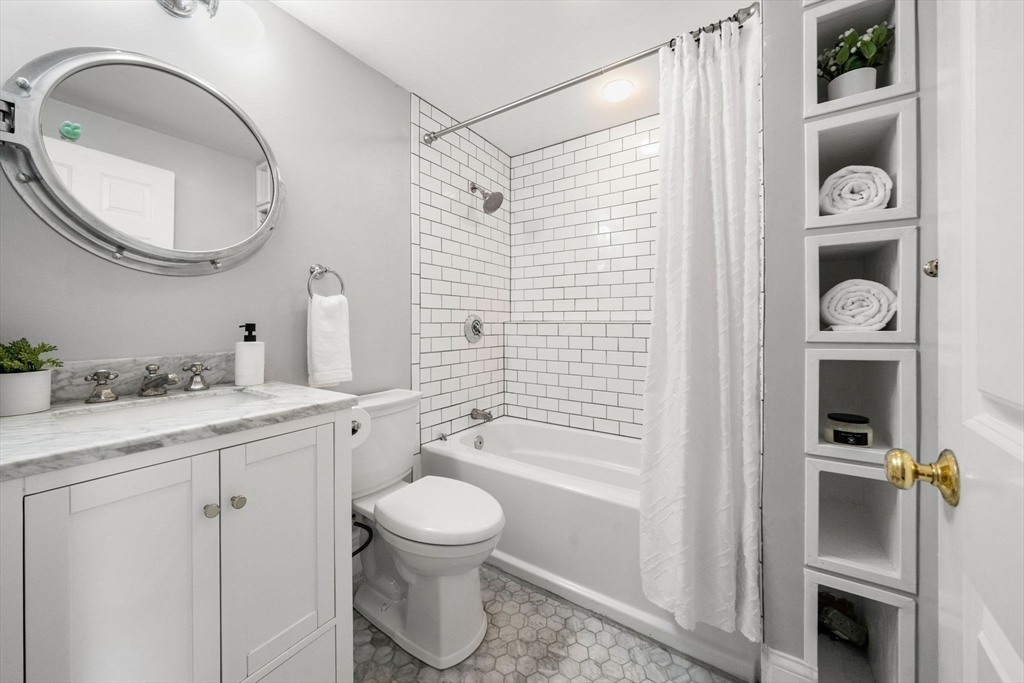 3 Glover Court, Unit 2 Boston, MA 02127 - Photo 22 of 27 a bathroom with a granite countertop sink toilet and shower