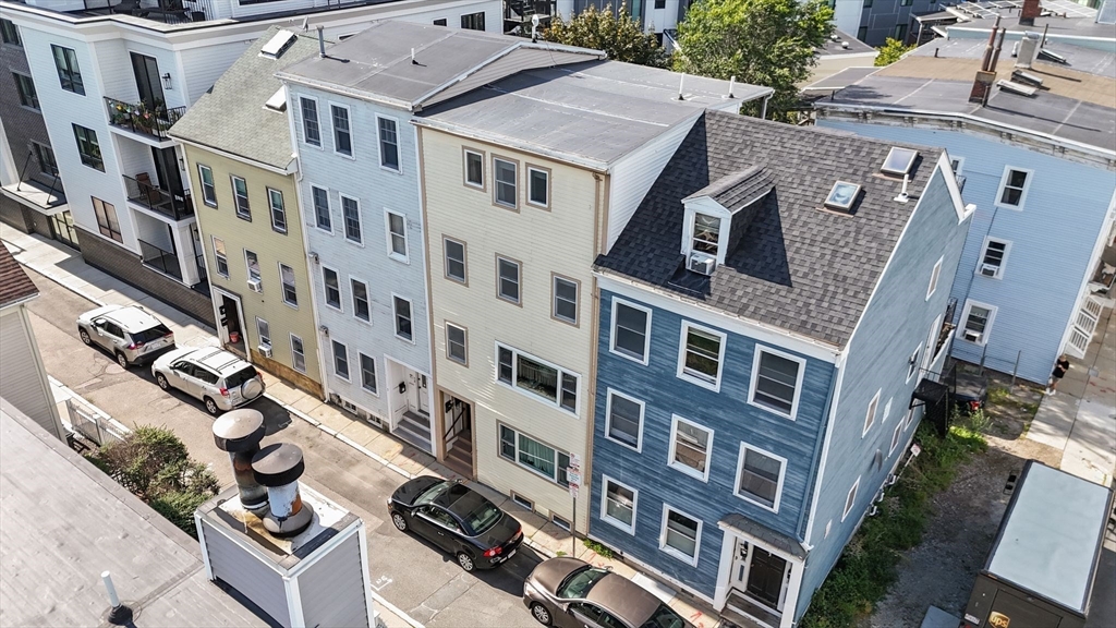 3 Glover Court, Unit 2 Boston, MA 02127 - Photo 26 of 27 a front view of a building with glass windows