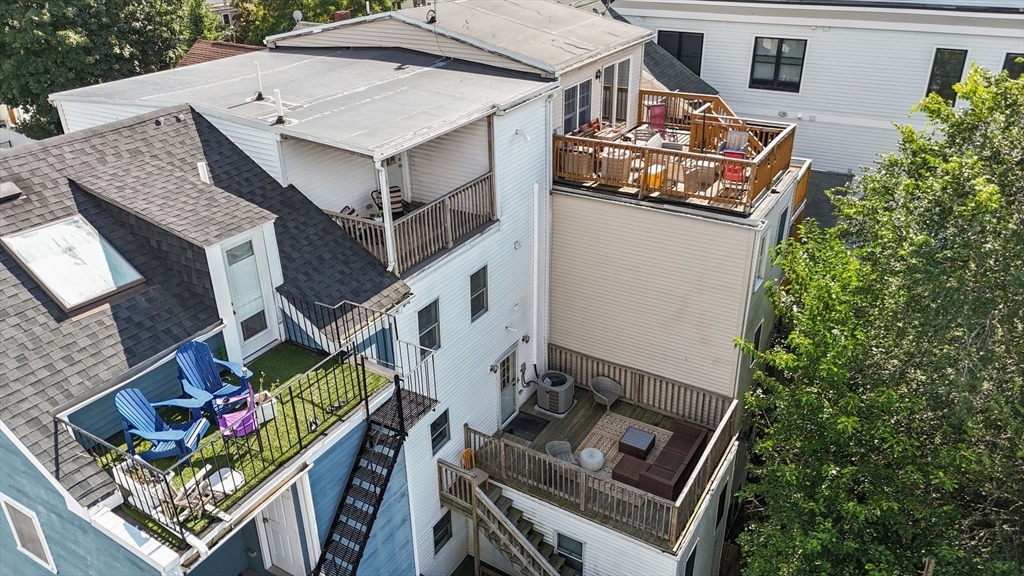 3 Glover Court, Unit 2 Boston, MA 02127 - Photo 27 of 27 an aerial view of a house with balcony and outdoor space