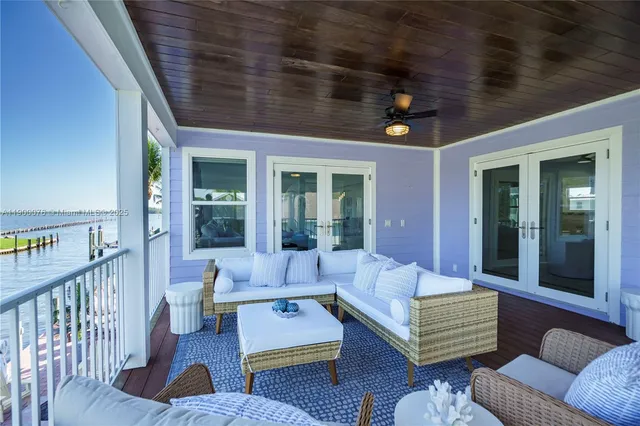 an aerial view of a house with a yard and potted plants