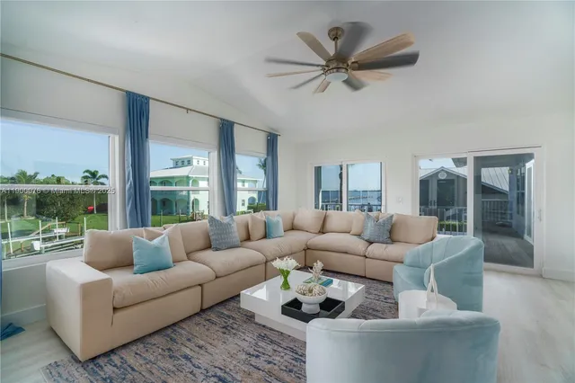 a large kitchen with kitchen island granite countertop lots of counter top space and stainless steel appliances