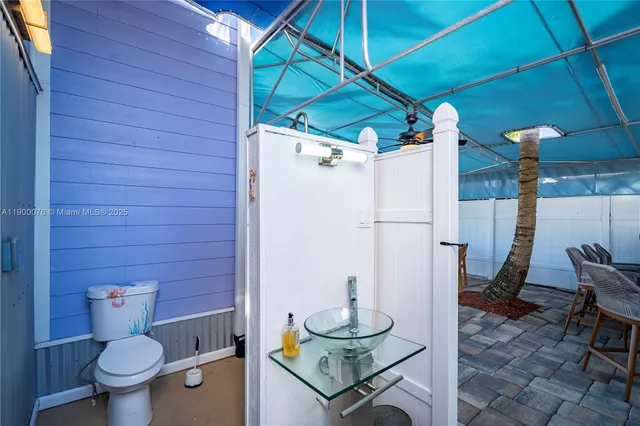 an aerial view of a house with a swimming pool patio and outdoor seating