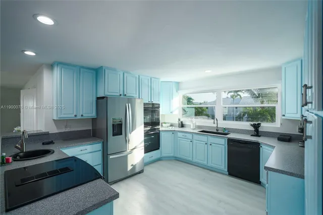 a living room with furniture or couch and a potted plant