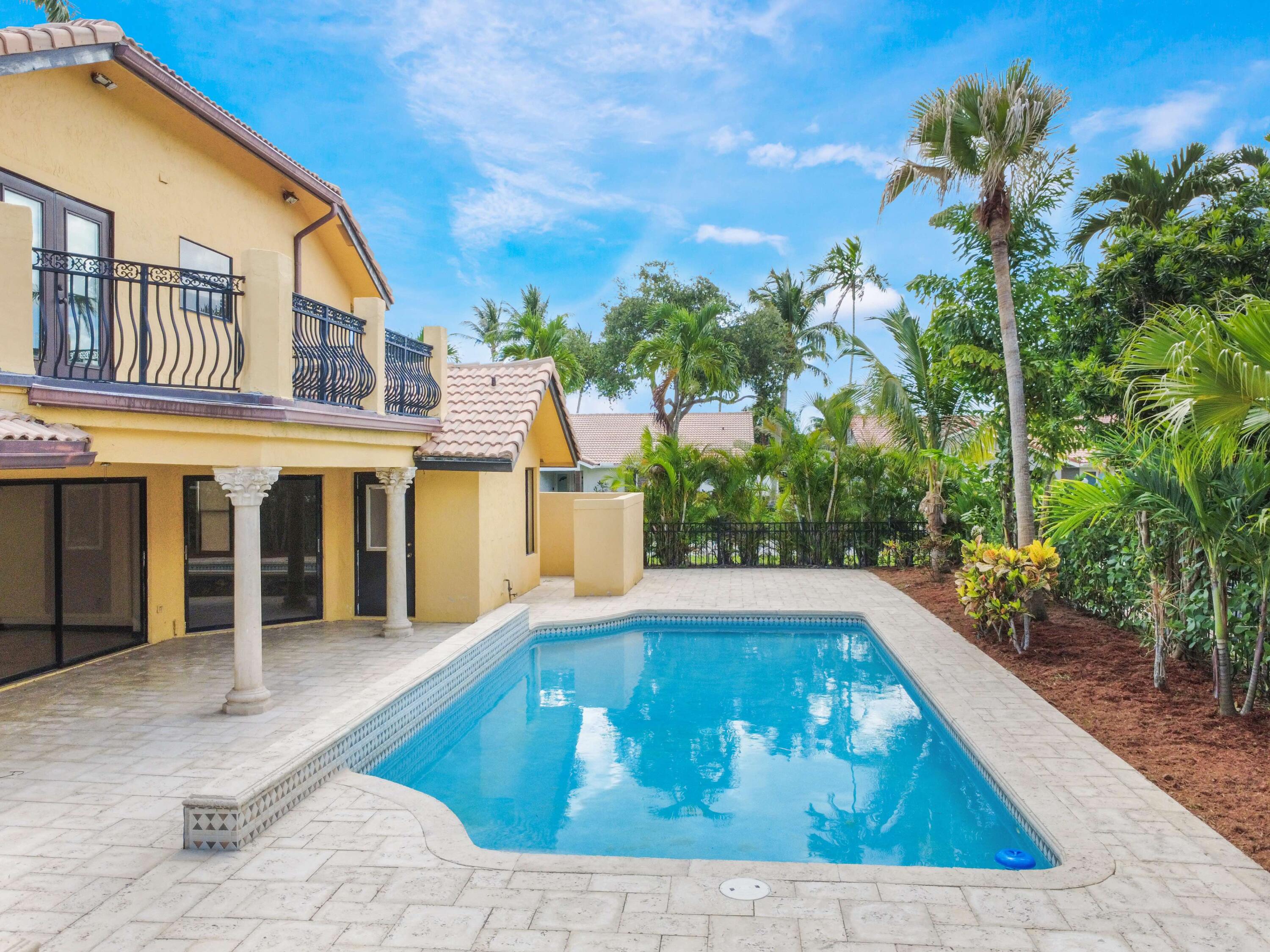 21130 White Oak Avenue Boca Raton, FL 33428 - Photo 24 of 38 a view of a house with a swimming pool