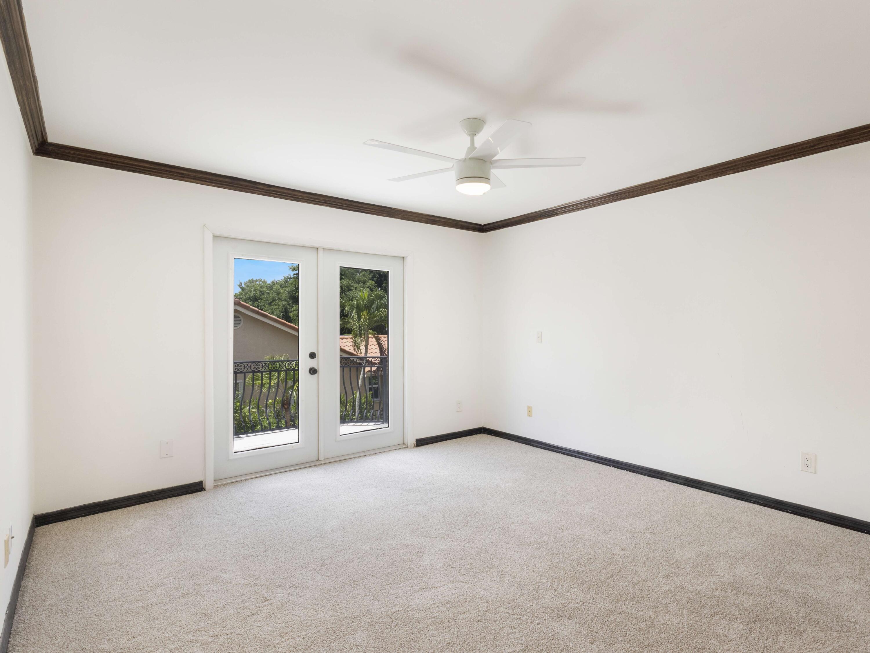 21130 White Oak Avenue Boca Raton, FL 33428 - Photo 29 of 38 an empty room with windows and closet
