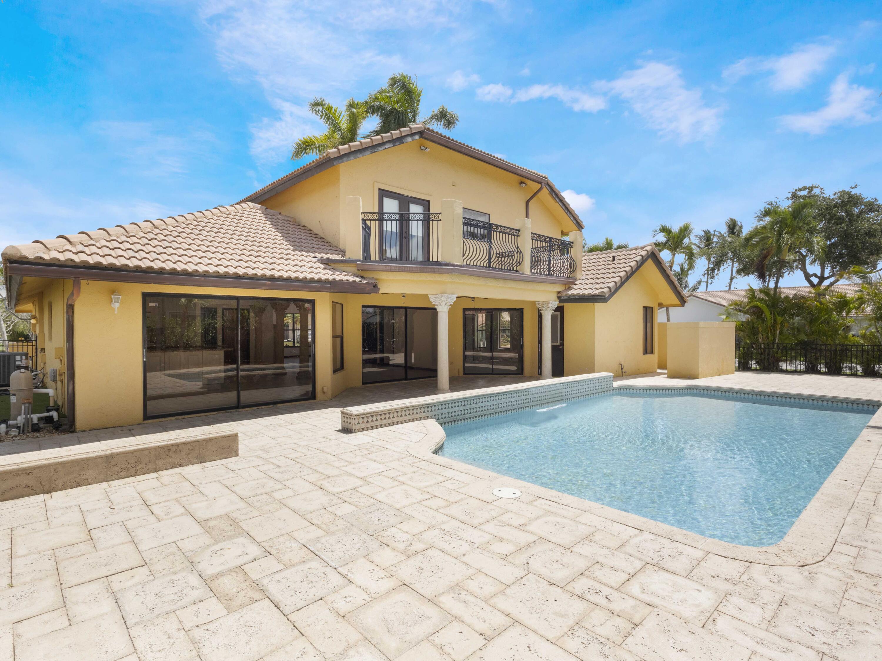 21130 White Oak Avenue Boca Raton, FL 33428 - Photo 32 of 38 a view of a house with a swimming pool