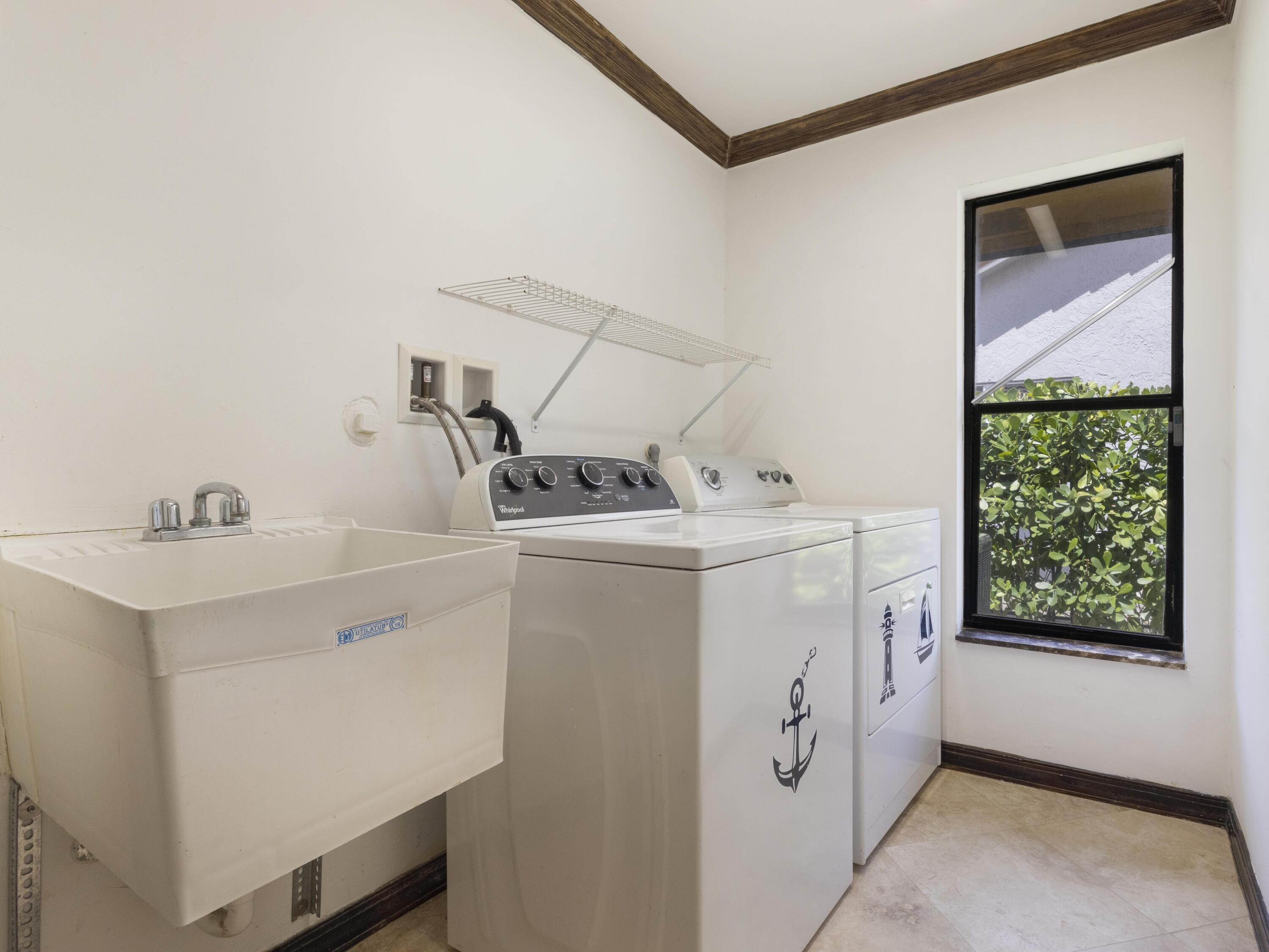21130 White Oak Avenue Boca Raton, FL 33428 - Photo 33 of 38 a utility room with dryer and washer