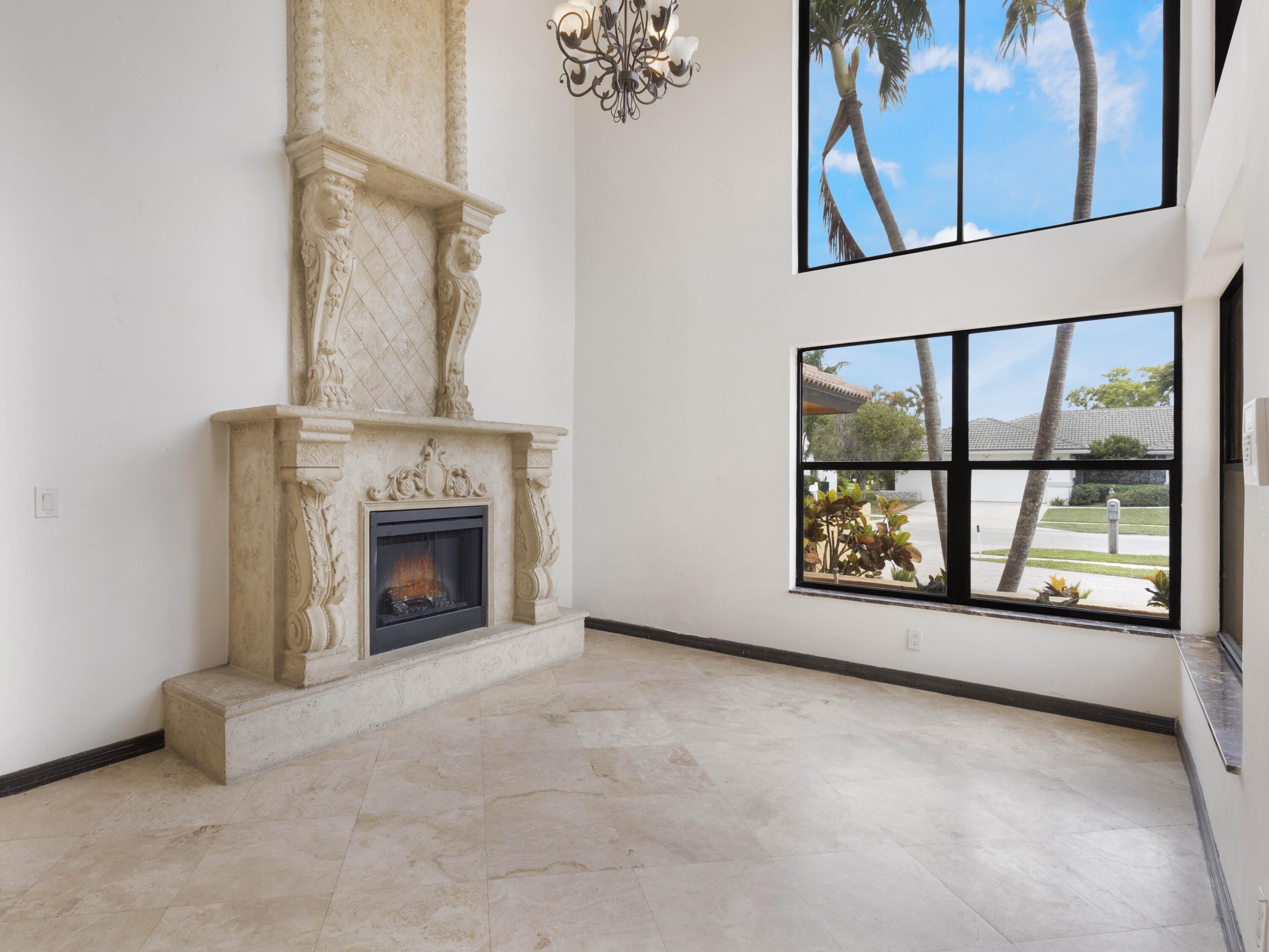 21130 White Oak Avenue Boca Raton, FL 33428 - Photo 7 of 38 an empty room with windows and fireplace