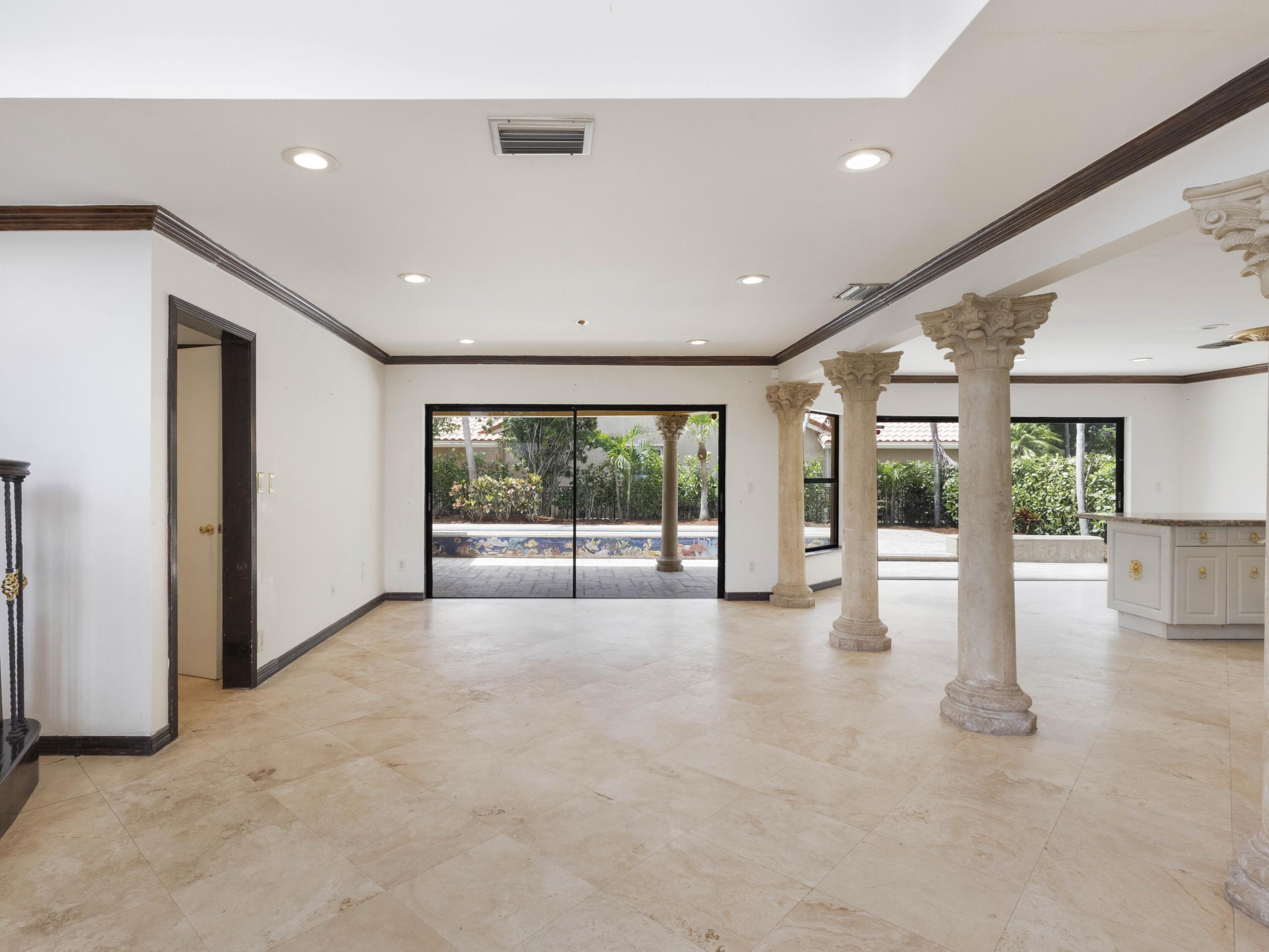 21130 White Oak Avenue Boca Raton, FL 33428 - Photo 10 of 38 a view of an empty room with wooden floor and a window