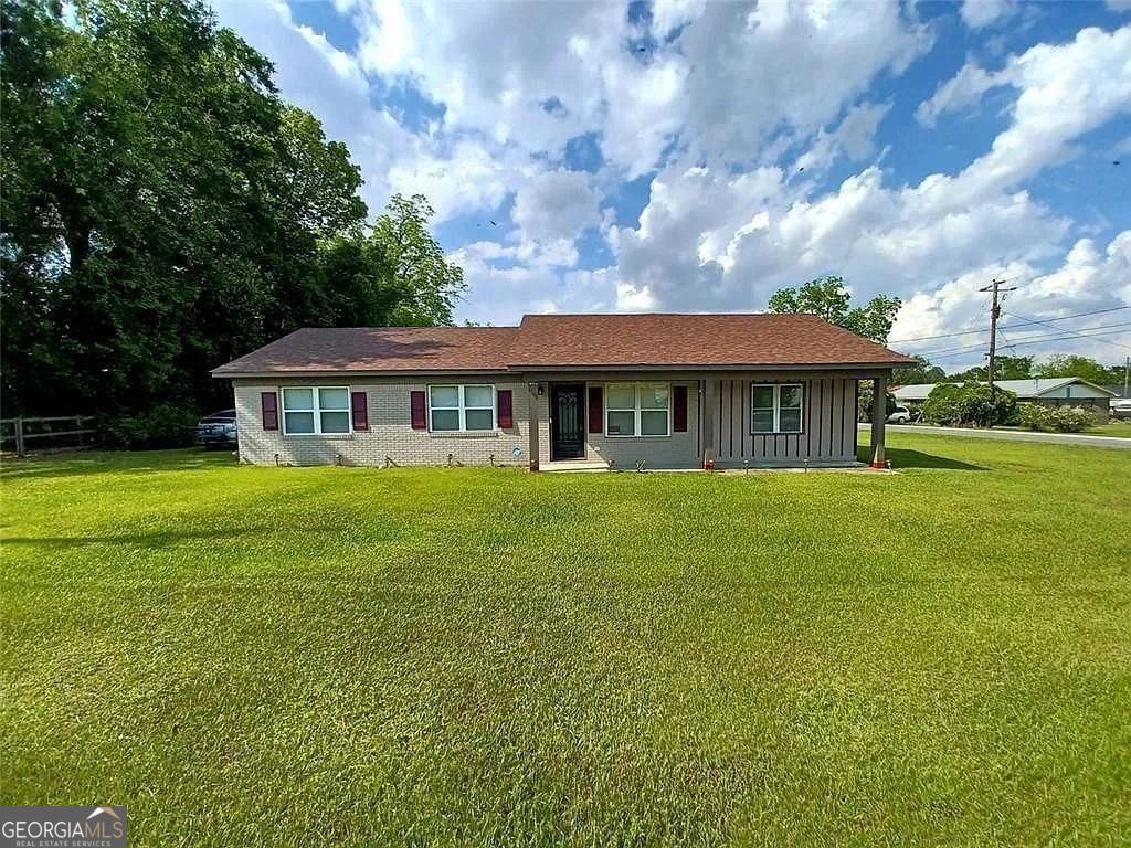 156 East Geer Street Colquitt, GA 39837 - Photo 1 of 19 a house with swimming pool in front of it