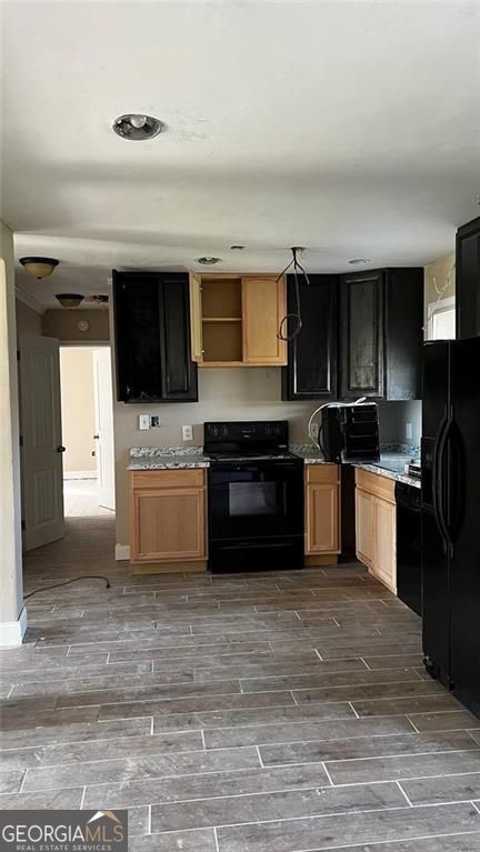 156 East Geer Street Colquitt, GA 39837 - Photo 9 of 19 a kitchen with a stove a sink and a refrigerator
