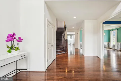an entryway at livingroom with furniture wooden floor and windows