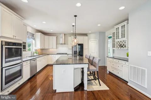 a bathroom with a granite countertop sink mirror and double