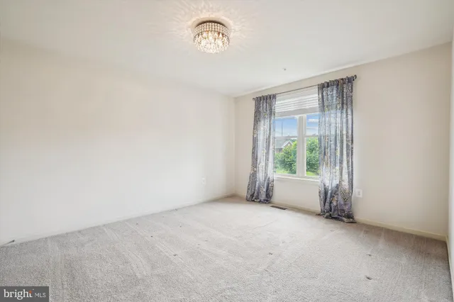 a view of a road with a building in the background