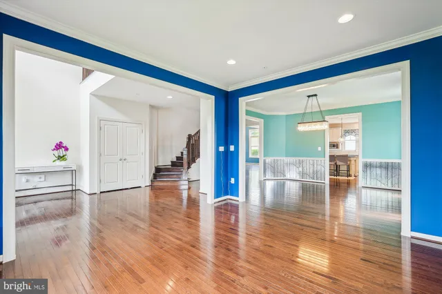 an entryway at livingroom with furniture wooden floor and windows