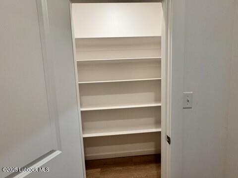 5719 Kemper Street, Unit A Lubbock, TX 79416 - Photo 12 of 21 a view of walk in closet with empty racks