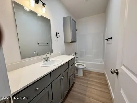 a view of wooden floor in a kitchen