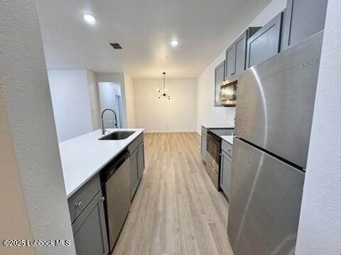 5719 Kemper Street, Unit A Lubbock, TX 79416 - Photo 8 of 21 a kitchen with sink a refrigerator and wooden floor