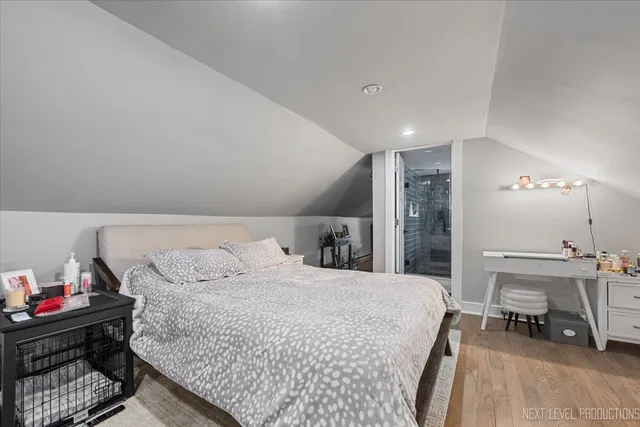 a bedroom with a bed and cabinets