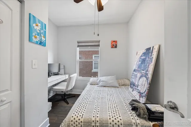 a bathroom with a granite countertop sink mirror and toilet