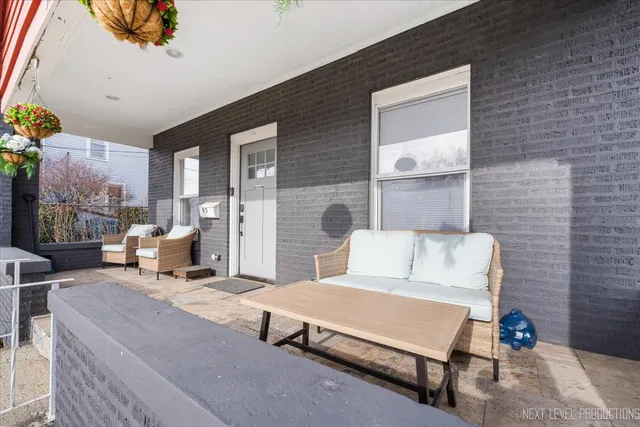 a living room with furniture a table and chairs