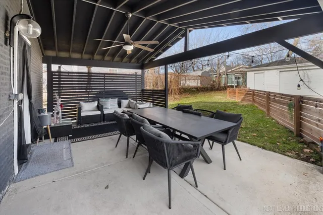 a front view of a house with a yard glass top table and chairs