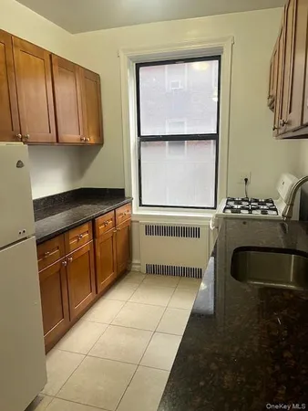 a kitchen with a cabinets and window
