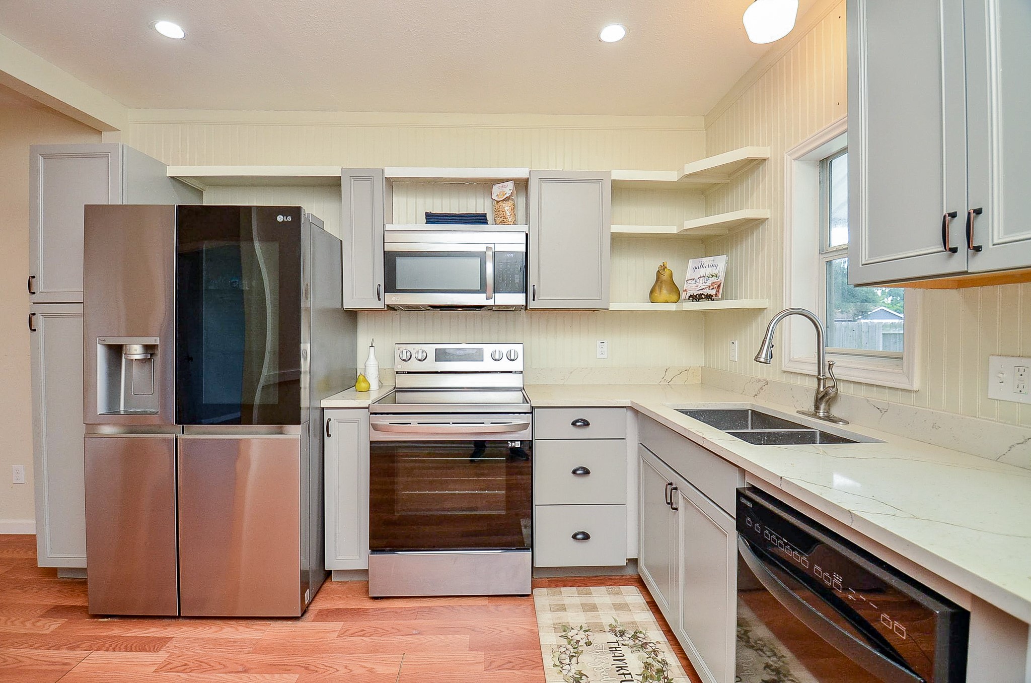 1615 Eagle Lake Road Sealy, TX 77474 - Photo 7 of 19 Here you will find this cozy kitchen complete with painted cabinets, open shelving for storage, stainless appliances and a quaint window with outside views!