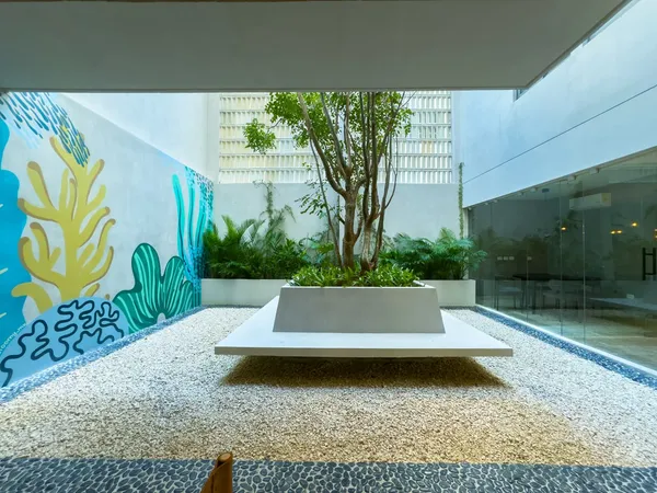 a view of swimming pool with outdoor seating and plants