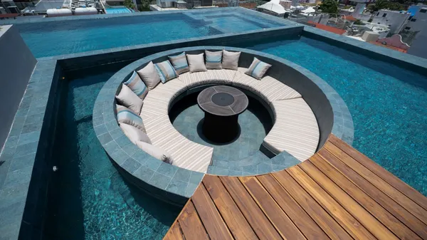 a view of swimming pool with outdoor seating