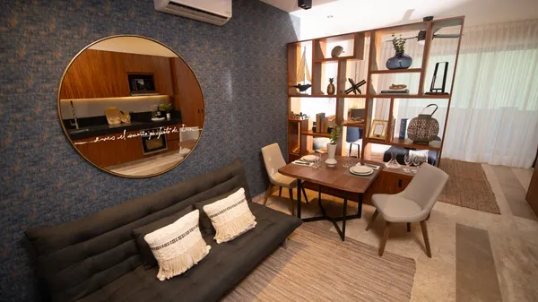 a view of a dining room with furniture and window