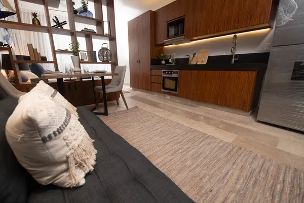 a kitchen with granite countertop a stove and a microwave