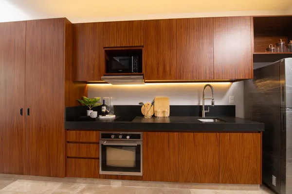 a kitchen with stainless steel appliances granite countertop a sink and cabinets