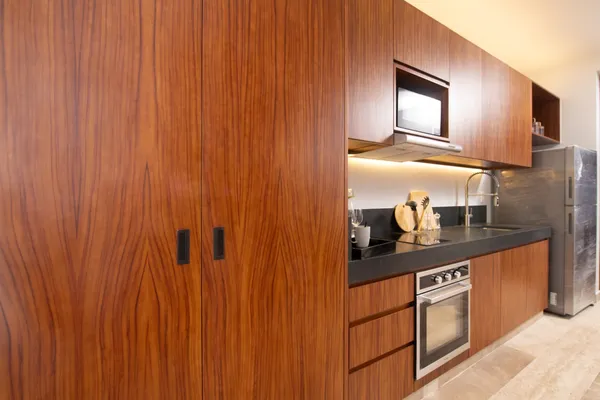 a living room with a couch and bookshelf