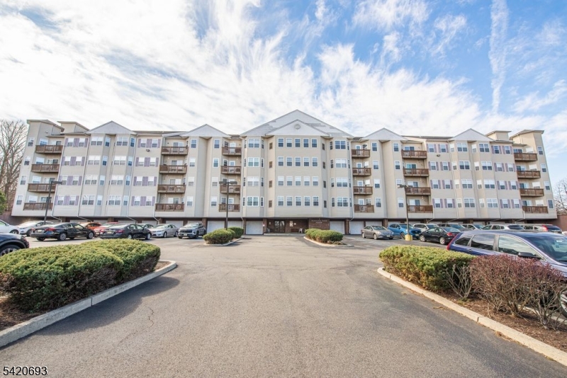 375 Rifle Camp Road, Unit 403 Woodland Park, NJ 07424 - Photo 1 of 24 a view of a city with tall buildings