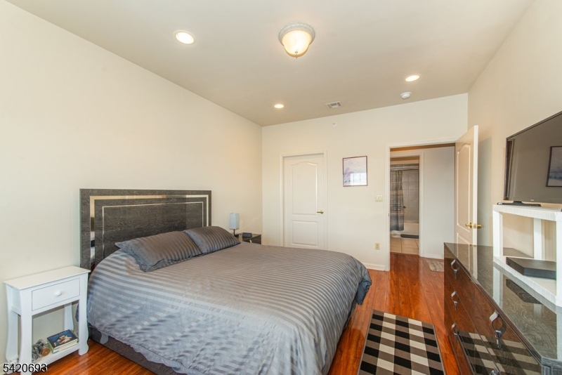 375 Rifle Camp Road, Unit 403 Woodland Park, NJ 07424 - Photo 17 of 24 a bedroom with a bed and a view of bedroom