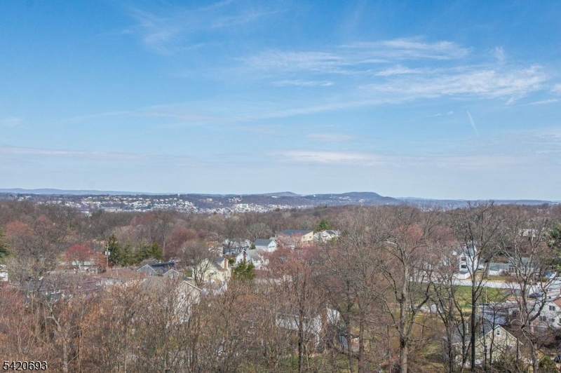 375 Rifle Camp Road, Unit 403 Woodland Park, NJ 07424 - Photo 2 of 24 a view of lake and mountain